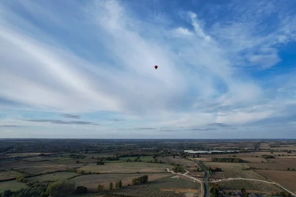 Aerial View of Air Balloon Flying Above British Landscape at Milton Keynes England