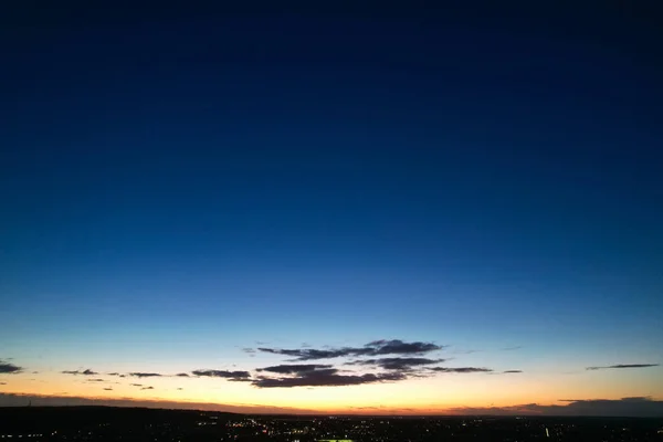 Beautiful Aerial View of British City and Roads at Night. Drone's High Angle Footage of Illuminated British Town.