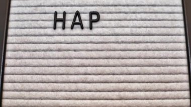 Happy Labor Day message on a short animation video. Black letters on a white letter board marquee.