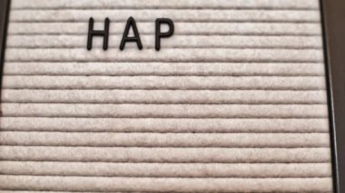 Happy Labor Day message on a short animation video. Black letters on a white letter board marquee.