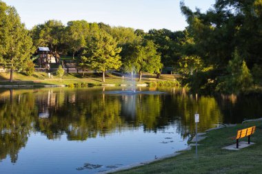 Fountain Spraying into Reflective Waters at Sar Ko Par Park in Lenexa Kansas