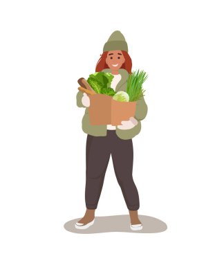 Woman holding and carrying a paper bag full of vegetables