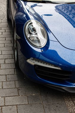 blue car with rain drops.