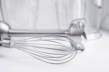 immersion blender. kitchen accessories whisk and whipping containers