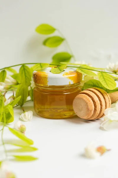 ACACIA HONEY. acacia flowers and jar