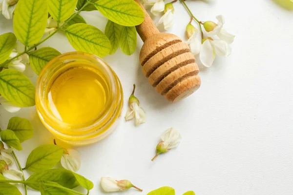 ACACIA HONEY. acacia flowers and jar