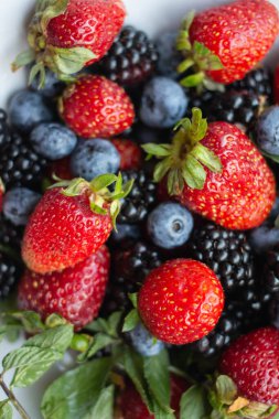seasonal berries in white dish 
