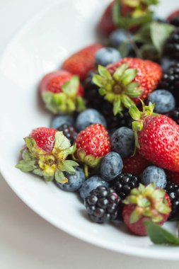 seasonal berries in white dish 