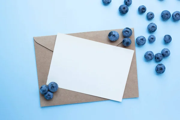 mockup card with blueberry and mint. invitation card with environment and details Mockup with postcard and berries. recipe card