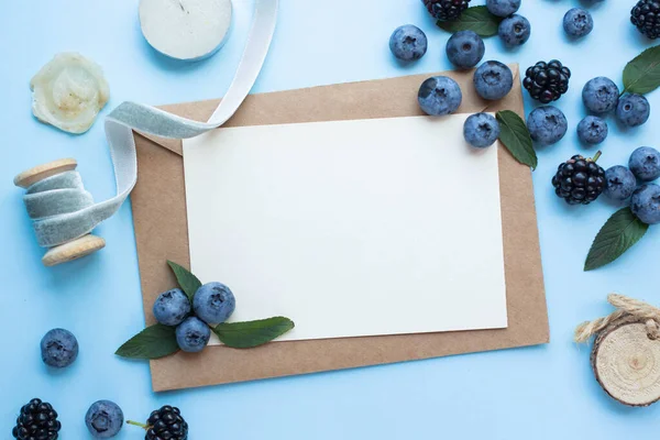 mockup card with blueberry and mint. invitation card with environment and details Mockup with postcard and berries. recipe card