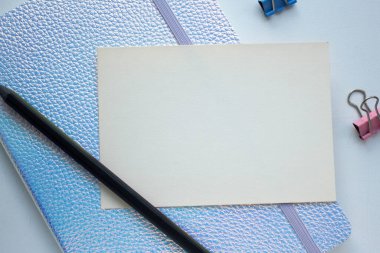 notebook, phone, pencil and card