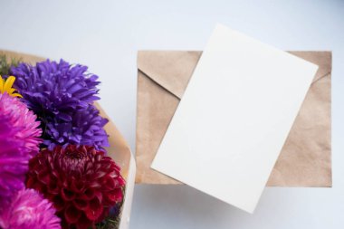 invitation card mockup with asters. autumn bouquet