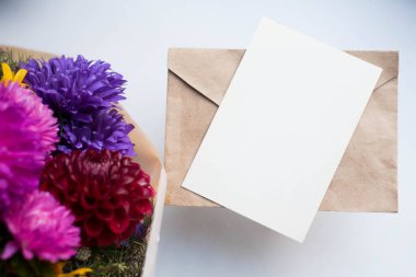 invitation card mockup with asters. autumn bouquet