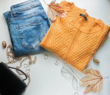 card mockup with yellow sweater and blue jeans, golden details, tea with lemon and fall leaves