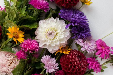 background of colorful flowers. asters. autumn bouquet on table