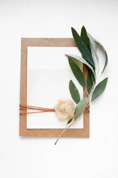 invitation card with leaves, stones and wood