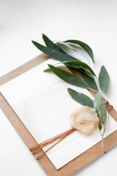 invitation card with leaves, stones and wood