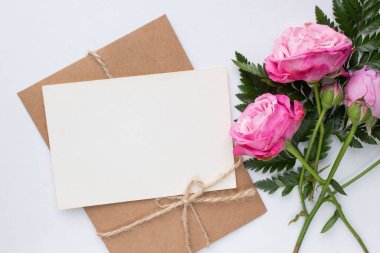 card mockup with roses, ring and envelope. wedding invitation in minimalist style with leaves, wax