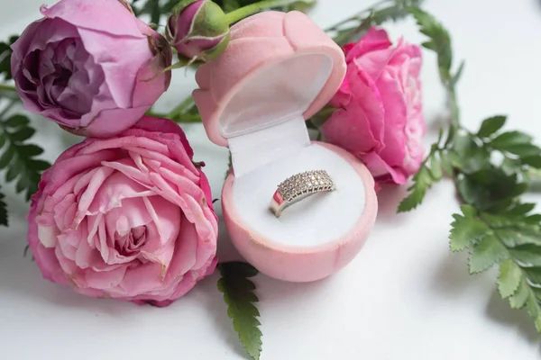 roses and ring in box. proposal golden ring, present to Valentine\'s day. love present.