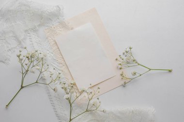 card mockup with white flowers and envelope. wedding invitation 