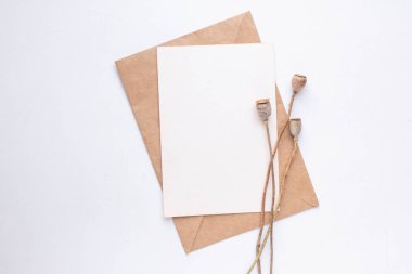 card mockup with dry flowers and envelope. invitation 