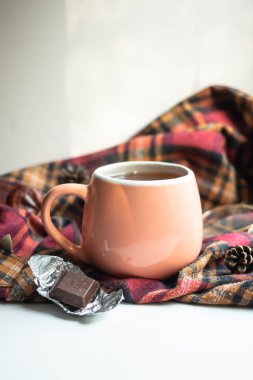 cup of morning tea with coockies and chocolate. lights, glasses 