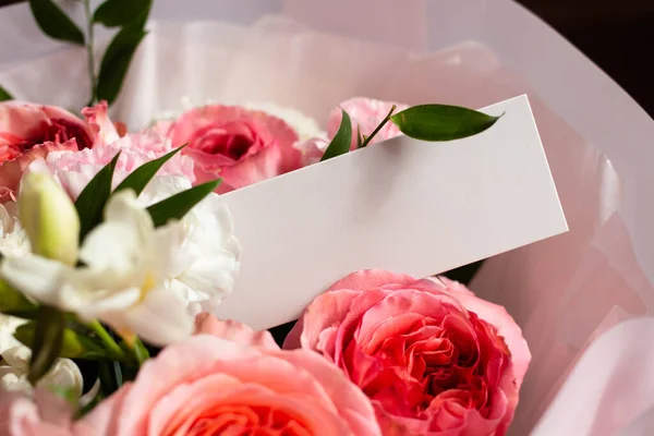 bouquet of flowers and a card from the sender. unknown admirer. Roses, carnations, lisianthus. card mockup