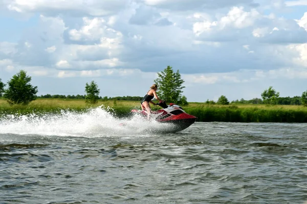 woman on a water bike on a river