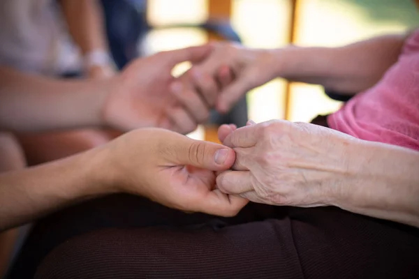Close Hands Elderly Person Holding Those Young Man Symbol Compassion — Fotografia de Stock