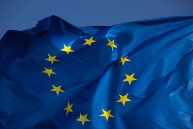 European flag in the wind with a beautiful blue sky in the background. Place to place text