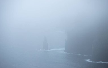 The Cliffs of Moher in Ireland in rain and foggy weather
