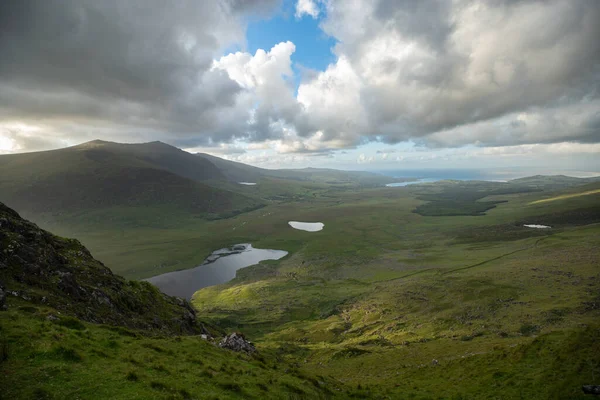 beautiful view of an Ireland landscape. Set of lakes with beautiful light and a ray of sunshine shining through the clouds