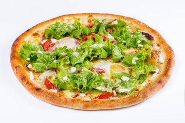 Pizza with fried egg, salad, tomatoes, cheese and pepper on a white background