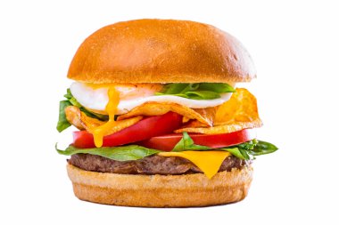 Burger with salad, meat cutlet, tomatoes, fried egg, potatoes and cheese on a white background. Horizontal orientation