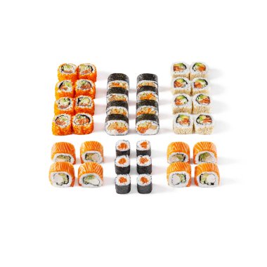 Assorted different rolls, with salmon, shrimps, sesame seeds, eel, avocado, tobiko caviar, cucumbers, omelet, on a white background