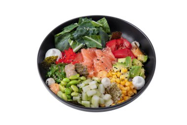 Salad with salmon, beans, cucumber, avocado, corn, rice, tobiko caviar, chukoy, pepper, tomatoes, mozzarella, spinach, nori and sesame seeds in a plate on a white background