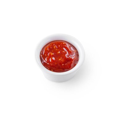Red sauce in a bowl on a white background