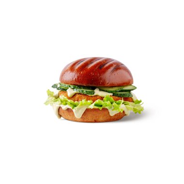 Hamburger with sauce, chicken cutlet, salad and cucumber on a white background