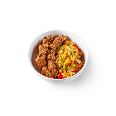 Rice with peppers, onions and meat in breading in a plate on a white background