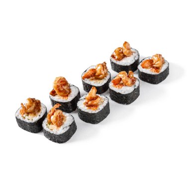 Rolls with shrimps, omelette, Philadelphia cheese, cucumbers and sauce on a white background
