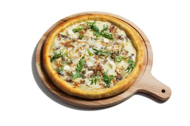 Pizza with cheese, arugula mushrooms, meat and sauce on a wooden board on a white plate