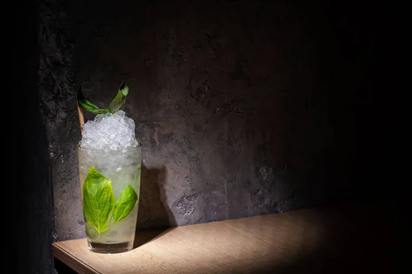 Cocktail Ice Basil Straw Glass Stands Table Background Stone Wall — ストック写真