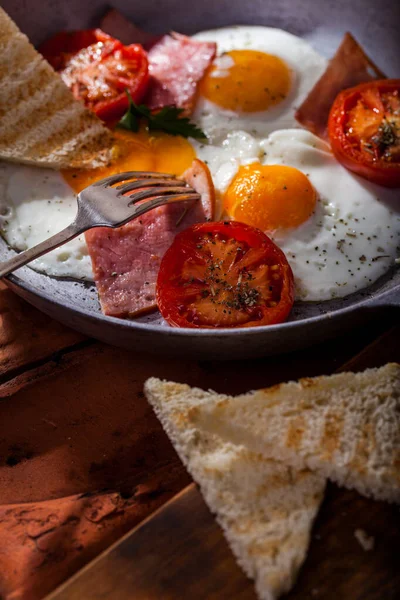 Fried Eggs Three Eggs Ham Fried Tomatoes Toast Fork Top — Stock Photo, Image