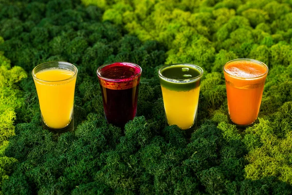 Four Glasses Carrot Beet Celery Sea Buckthorn Juice Background Stabilized — Stockfoto