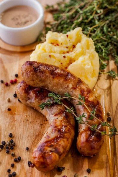 Grilled Chicken Sausages Mashed Potatoes Sauce Thyme Wooden Board — Stock Photo, Image