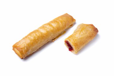 Beyaz tabakta ahududu reçeli tüp, yakın plan. Tam ve bölgesel dolgu. Yatay yönelim