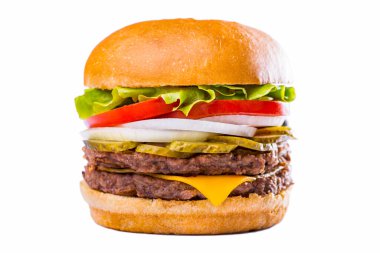 Burger with lettuce, double meat cutlet, tomatoes, onions, fried bacon, pickles and cheese on a white background. Horizontal orientation