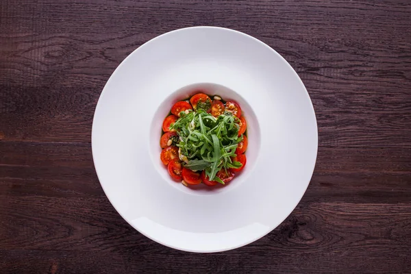 Salad Tomatoes Arugula Mozzarella Sauce Plate Sauce Wooden Table — Stockfoto