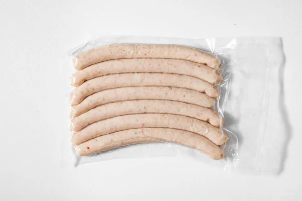 Vacuum Packed Raw Sausages White Background — Zdjęcie stockowe