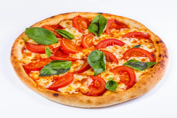 Pizza with tomatoes, cheese, basil and sauce on a white background